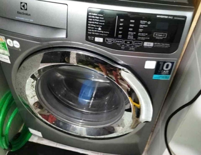 Vệ sinh máy giặt cửa ngang tại nhà quận 12 